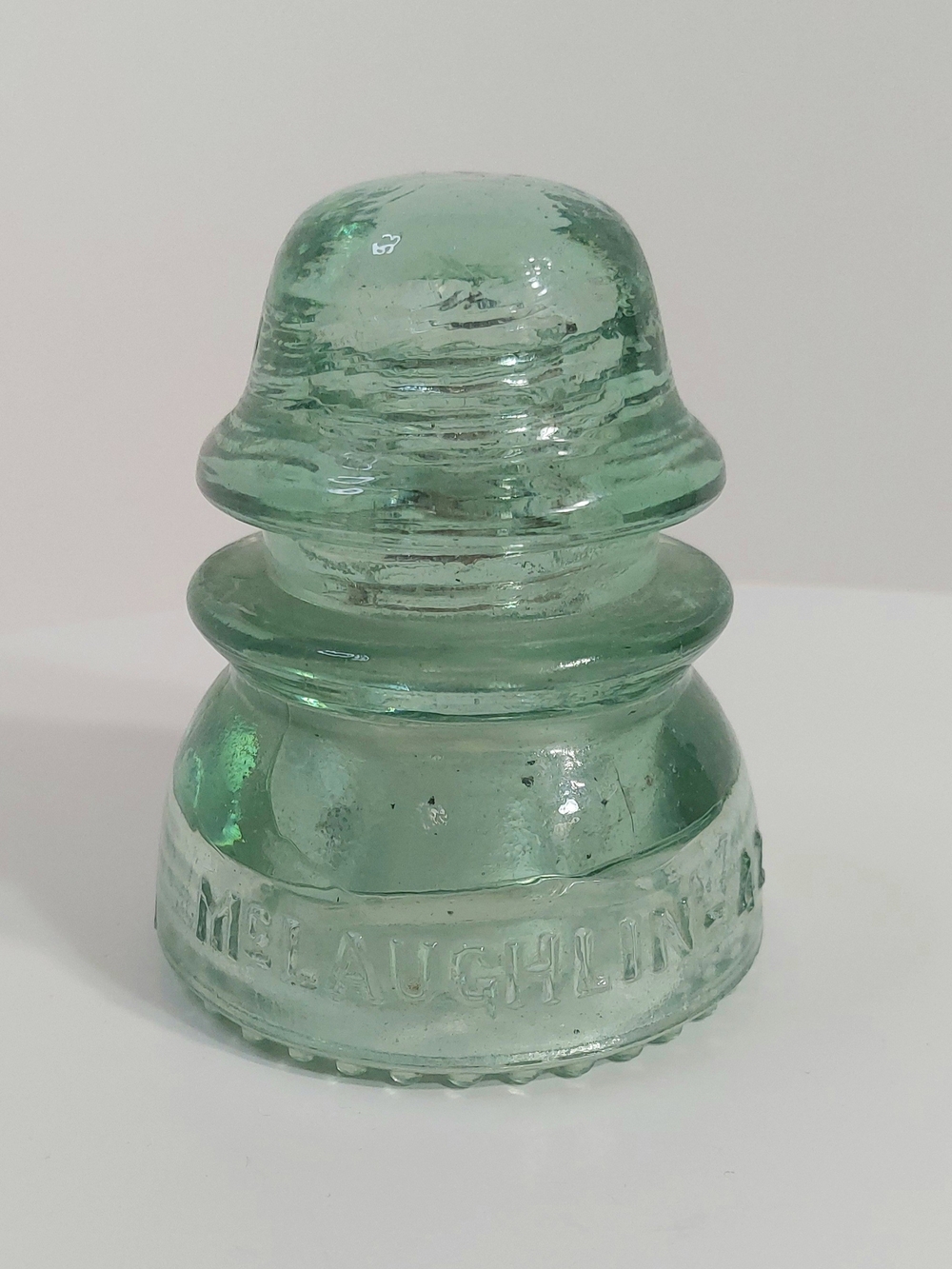 McLaughlin No. 42 Embossed "McLAUGHLIN" Green Glass Insulator